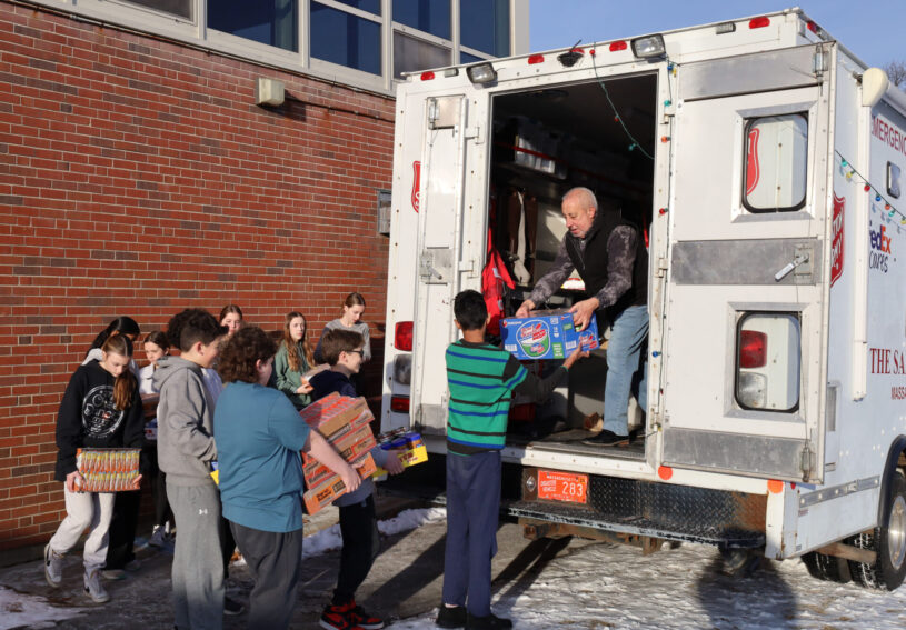 McCarthy Middle School students help load Project 300 donations into the Salvation Army truck on Thursday, Jan. 16, 2025.