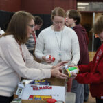 McCarthy Middle School students and staff help collect and sort donations for the Project 300 food drive on Thursday, Jan. 16.