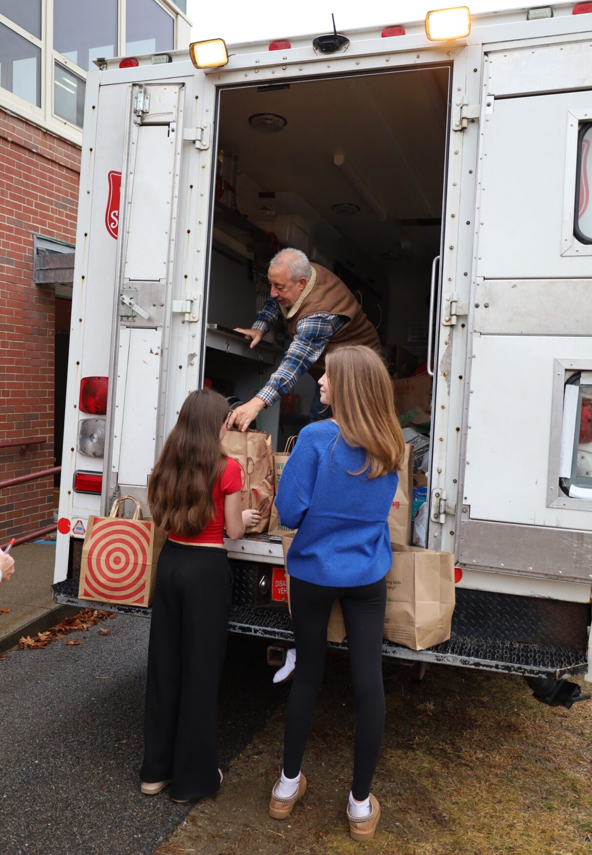 McCarthy Middle School students help load Project 300 donations onto the Salvation Army truck on Thursday, January 15, 2026.